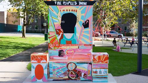 Colourful art sculpture, 'The People's Throne' by artist Adébayo Bolaji in Acton Gardens.