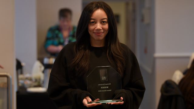 Monique Fernandez holding her L&Q Living Value Award