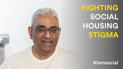 Headshot of Raj looking at the camera smiling. Raj is wearing a white top and wears square glasses. On the right of the image is text that reads: FIGHTING SOCIAL HOUSING STIGMA #iamsocial
